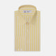 The Turnbull & Asser Yellow and White Bold Stripe Shirt features a T&A collar, 3-button cuffs, and white buttons. Displayed neatly folded on a plain white background, this long-sleeve shirt is perfect for office wear.