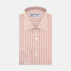 View 1 of product The Turnbull & Asser Pink and White Bold Check Shirt features a T&A collar and 3-button cuffs, displayed folded on a plain white background.