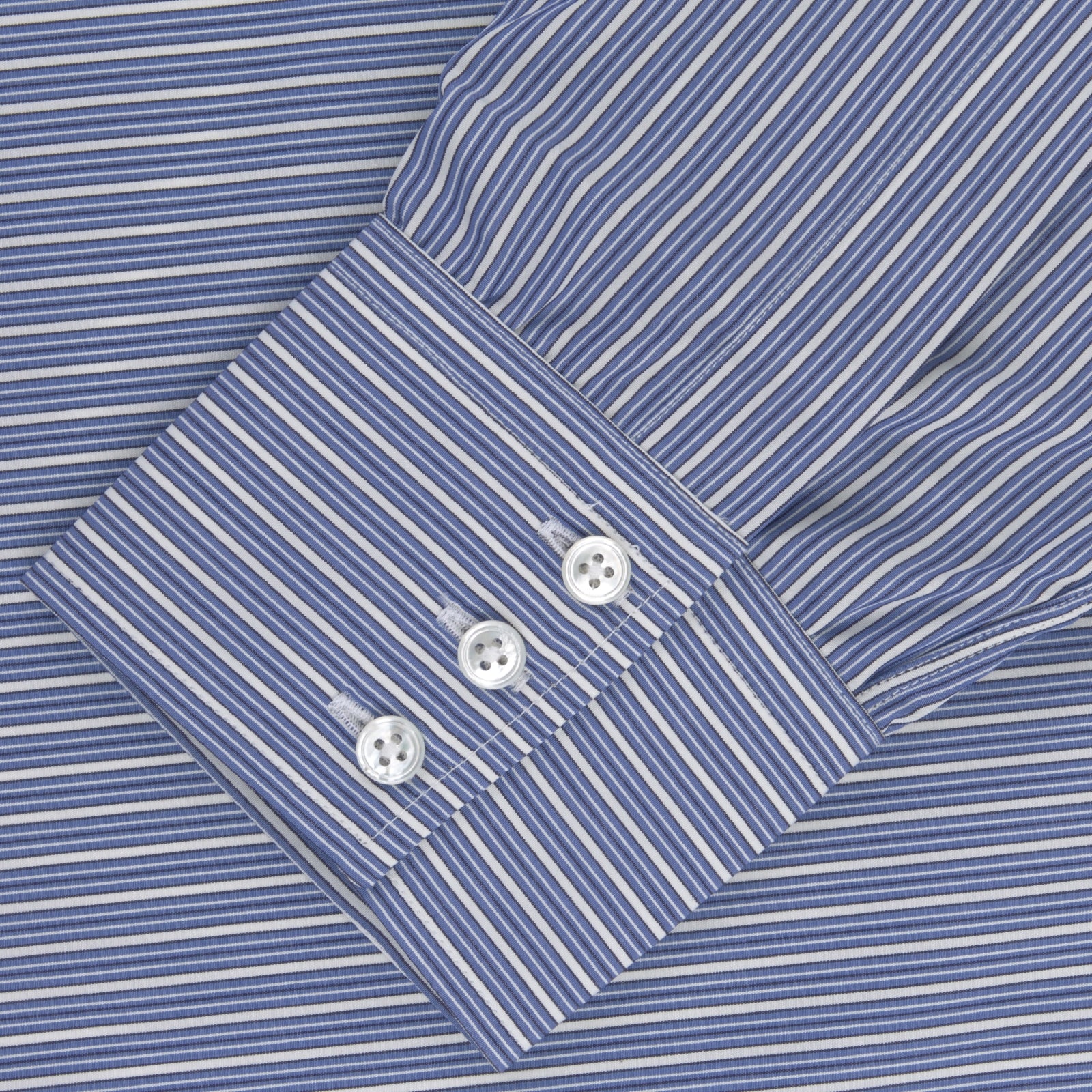 View 2 of product The Turnbull & Asser Navy Rich Stripe Shirt features a T&A collar, 3-button cuffs, blue with white vertical stripes, and a button-down front—shown laid flat on a white background.