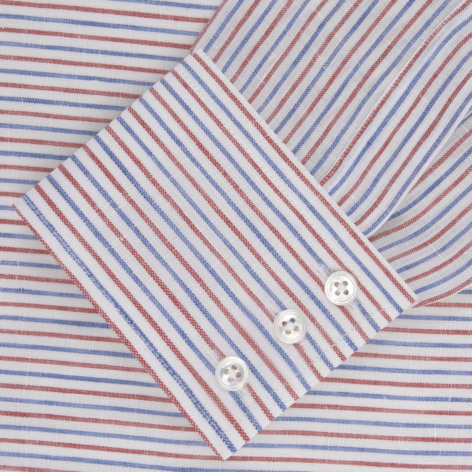 View 2 of product The Turnbull & Asser Red and Blue Ticking Stripe Linen Shirt features a POW collar, 3-button cuffs, white buttons, and a visible brand label inside the collar for timeless style.