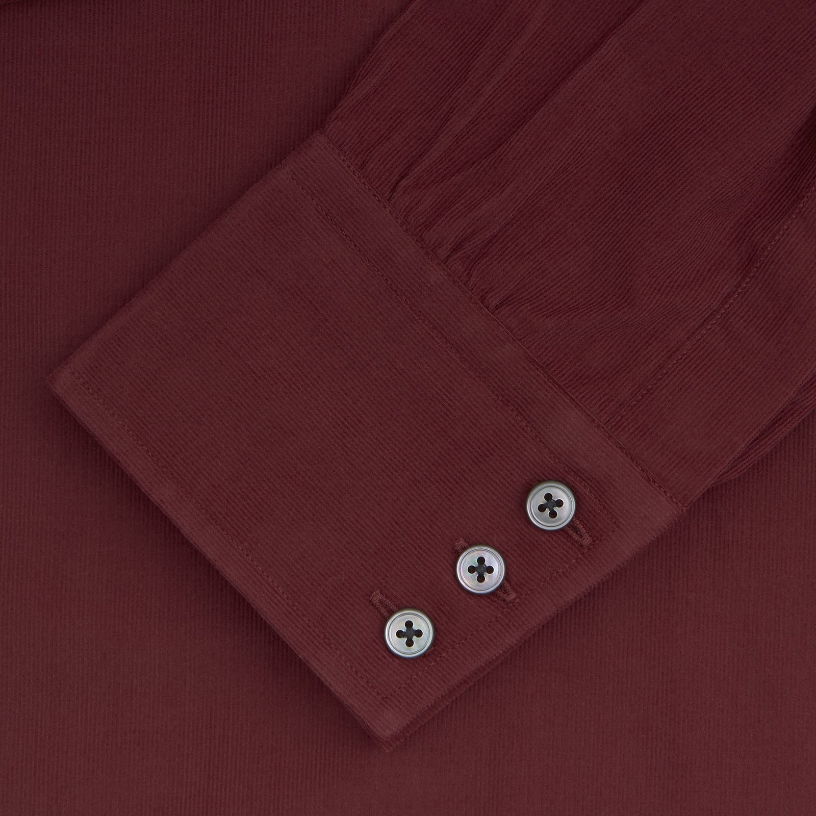 View 2 of product A Turnbull & Asser Burgundy Corduroy Cotton Shirt with a Cambridge collar and 3-button cuffs, neatly folded and displayed on a plain white background.