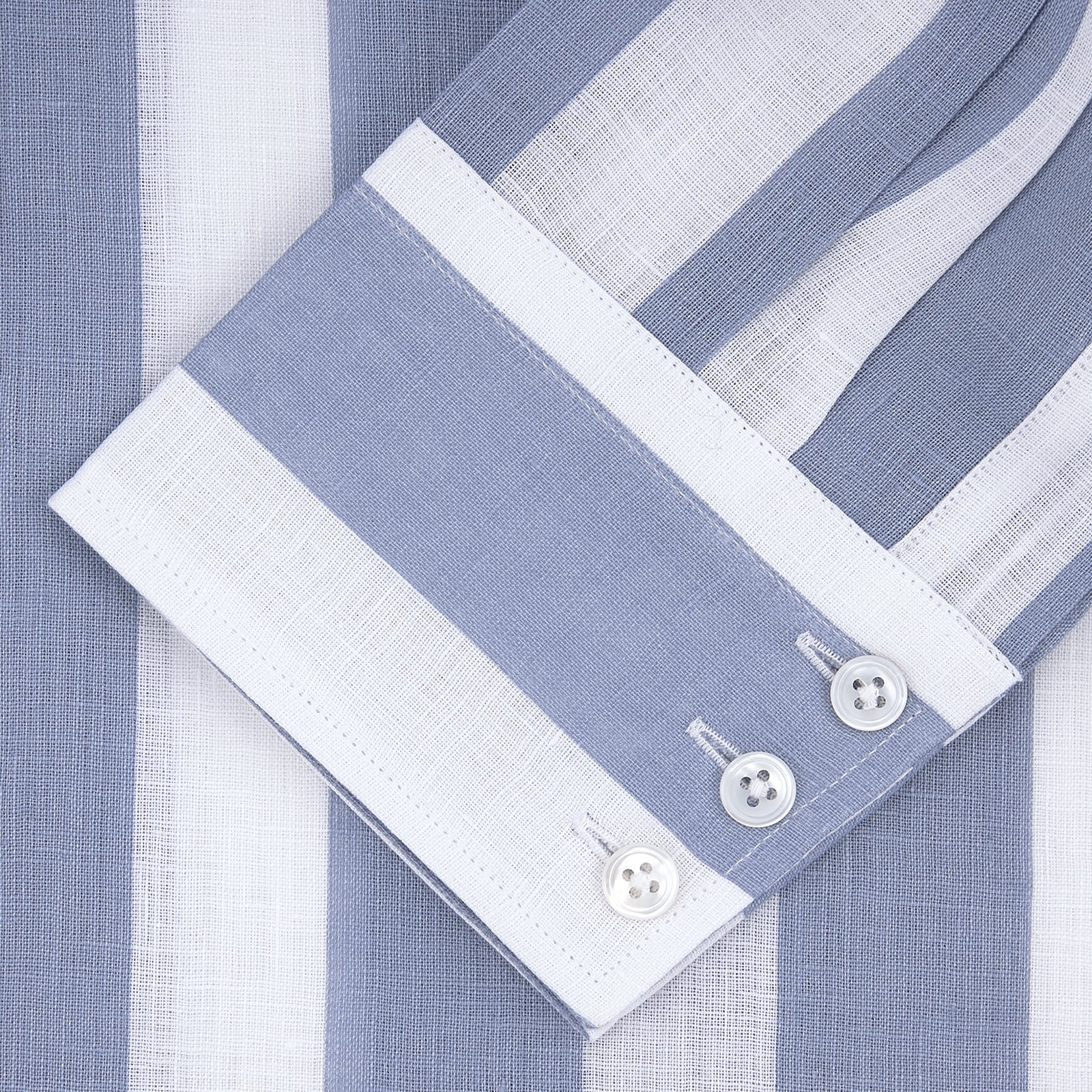 View 5 of product Turnbull & Asser's Tailored Fit Blue and White Stripe Linen Shirt features wide vertical stripes, a concealed button-down collar, and button cuffs—perfect for spring style.