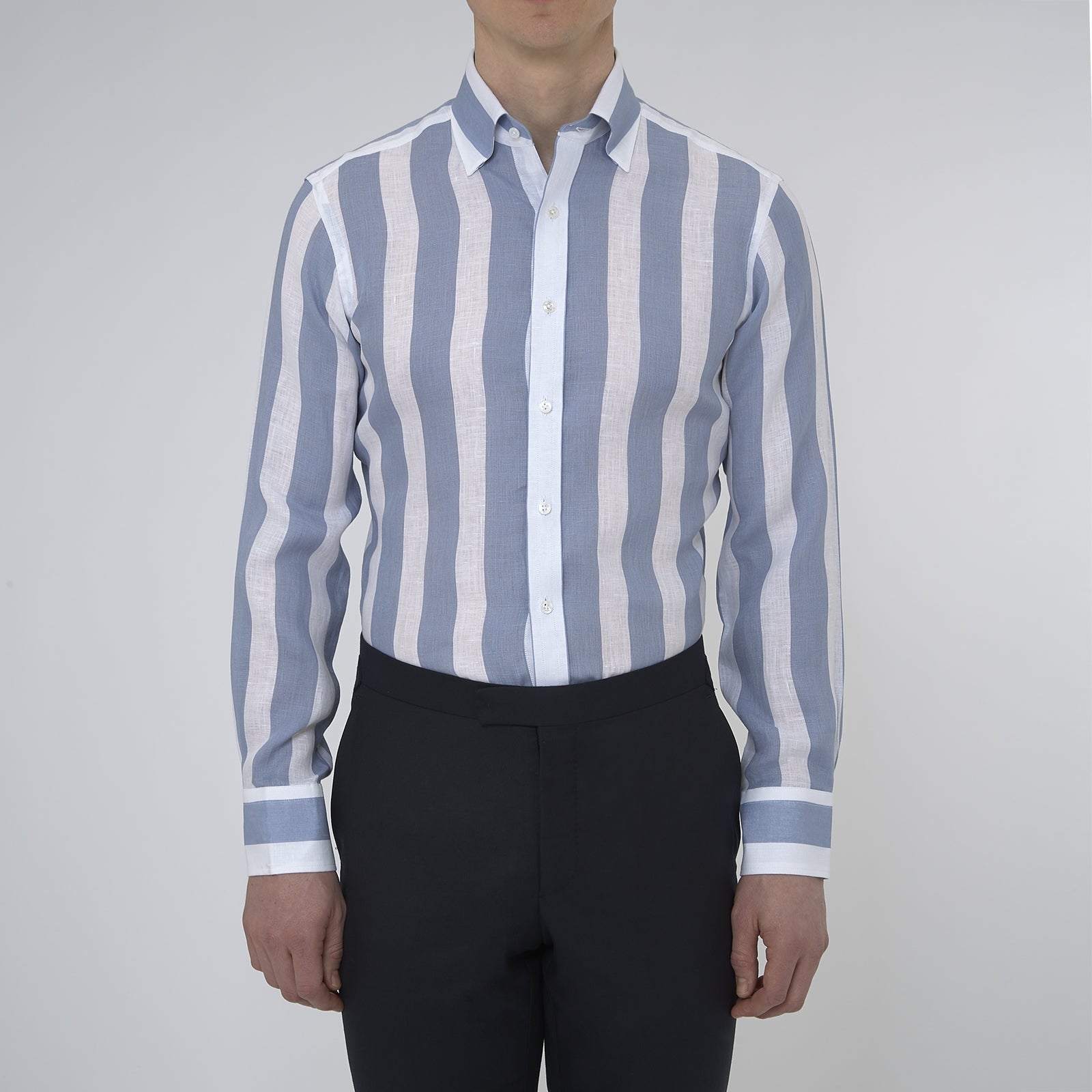 View 2 of product Turnbull & Asser's Tailored Fit Blue and White Stripe Linen Shirt features wide vertical stripes, a concealed button-down collar, and button cuffs—perfect for spring style.