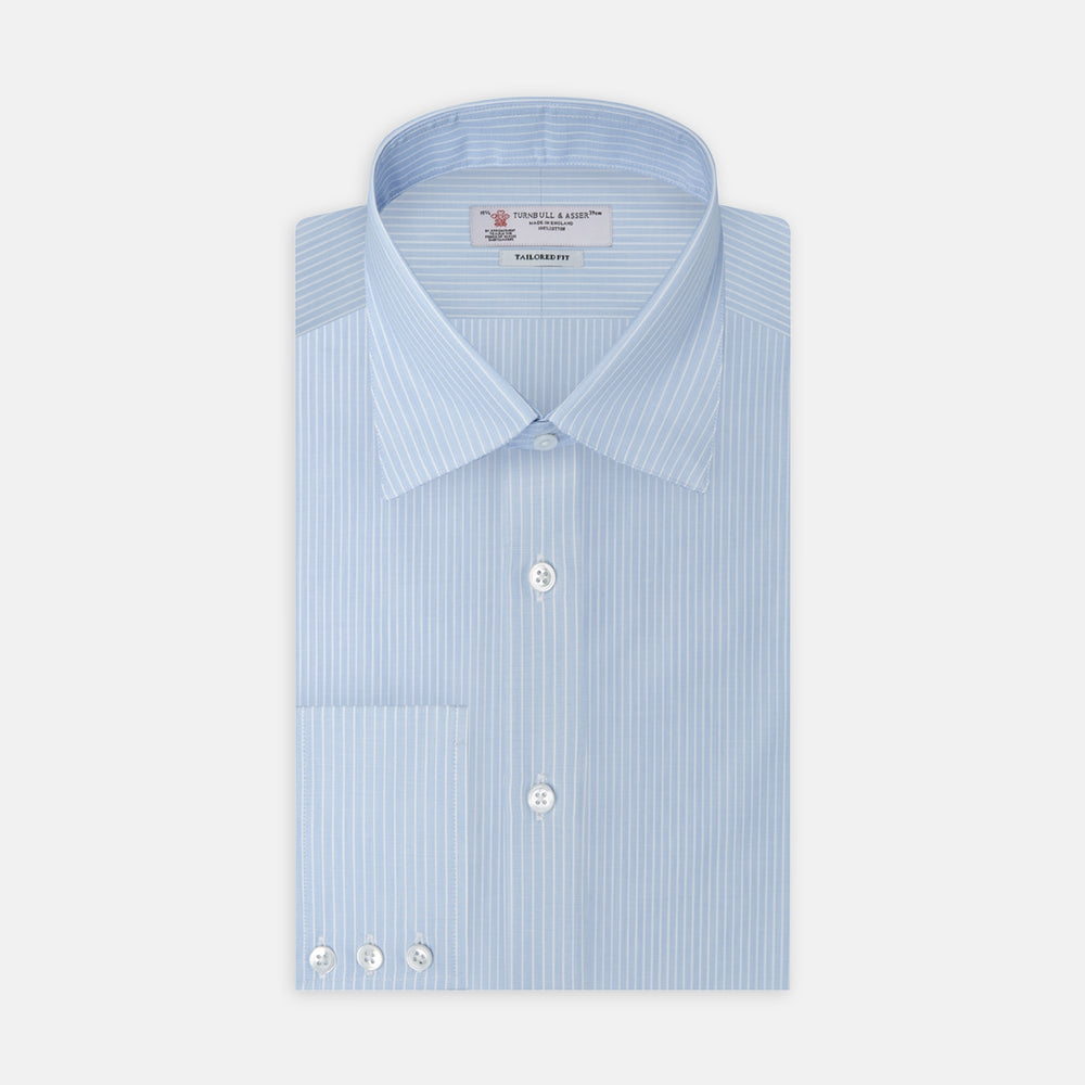 The Turnbull & Asser Tailored Fit Light Blue and White Pinstripe Shirt features a Bury collar and 3-button cuffs, neatly folded and displayed on a plain white background.