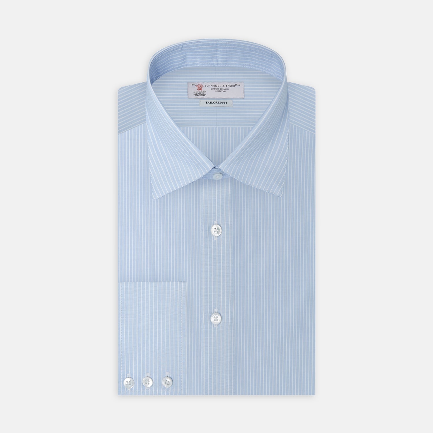 View 1 of product The Turnbull & Asser Tailored Fit Light Blue and White Pinstripe Shirt features a Bury collar and 3-button cuffs, neatly folded and displayed on a plain white background.