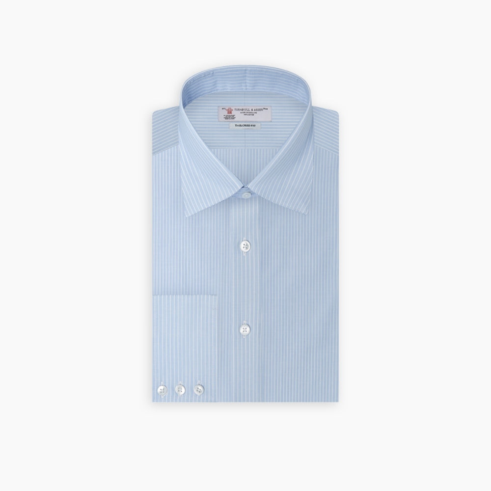 The Turnbull & Asser Tailored Fit Light Blue and White Pinstripe Shirt features a Bury collar and 3-button cuffs, neatly folded and displayed on a plain white background.