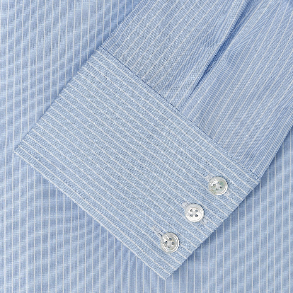 The Turnbull & Asser Tailored Fit Light Blue and White Pinstripe Shirt features a Bury collar and 3-button cuffs, neatly folded and displayed on a plain white background.