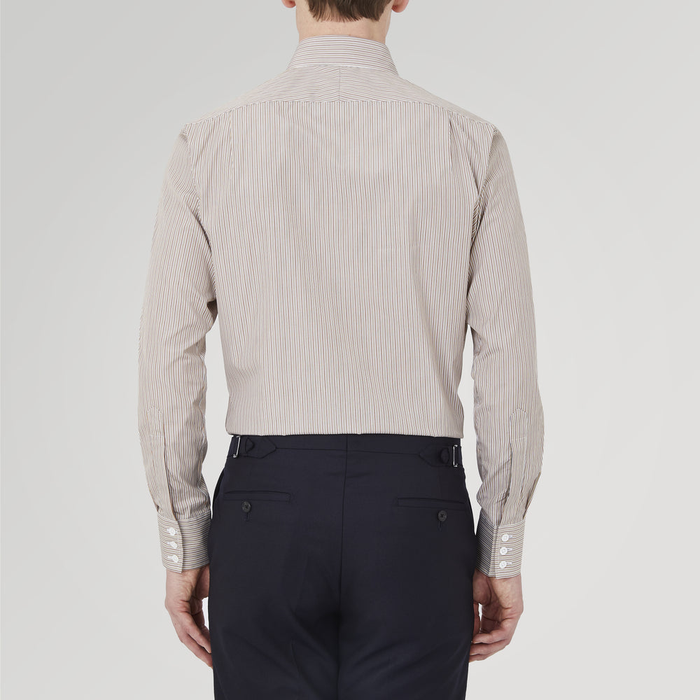 The Turnbull & Asser Tailored Fit Brown Fine Stripe Shirt features a Bury collar, 3-button cuffs, white buttons, and fine brown and white stripes. Made from premium Thomas Mason cotton and shown neatly folded on a plain white background.