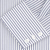 View 4 of product The Turnbull & Asser Tailored Fit Blue and White Stripe Sea Island Quality Cotton Shirt features a Bury collar and 3-button cuffs, neatly folded with white buttons, shown on a plain white background.