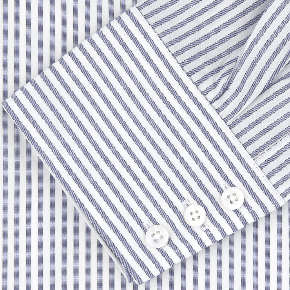 The Turnbull & Asser Tailored Fit Blue and White Stripe Sea Island Quality Cotton Shirt features a Bury collar and 3-button cuffs, neatly folded with white buttons, shown on a plain white background.
