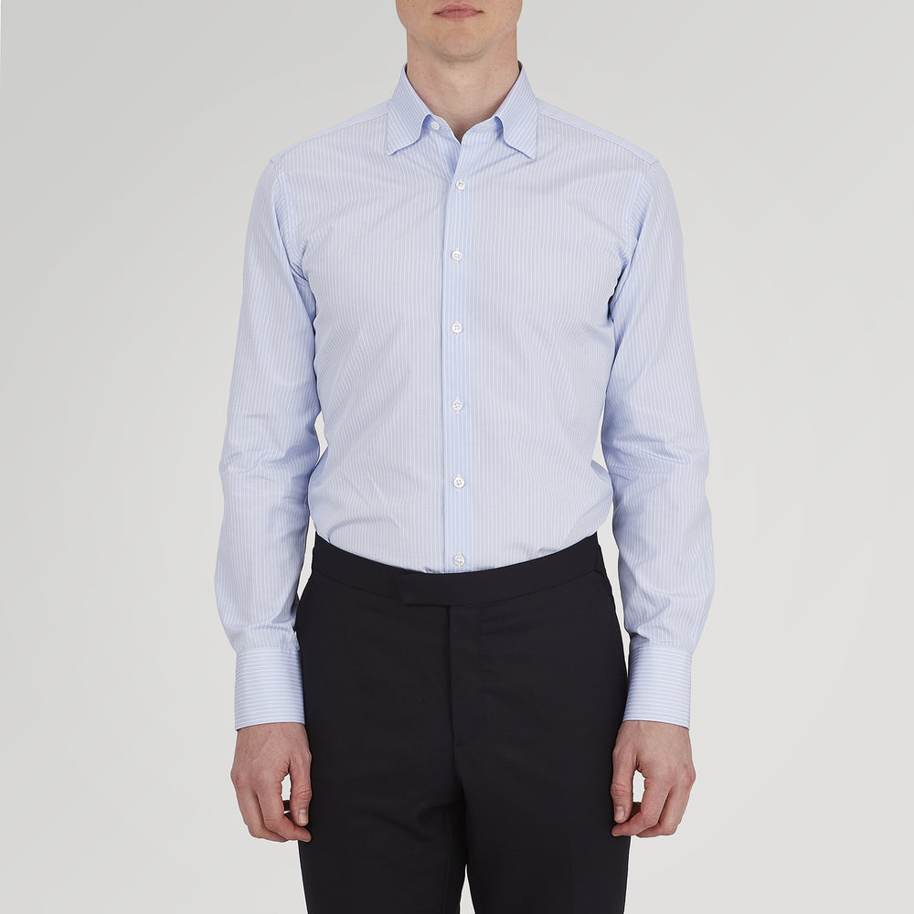 The Turnbull & Asser Tailored Fit Light Blue and White Pinstripe Shirt features a Bury collar and 3-button cuffs, neatly folded and displayed on a plain white background.