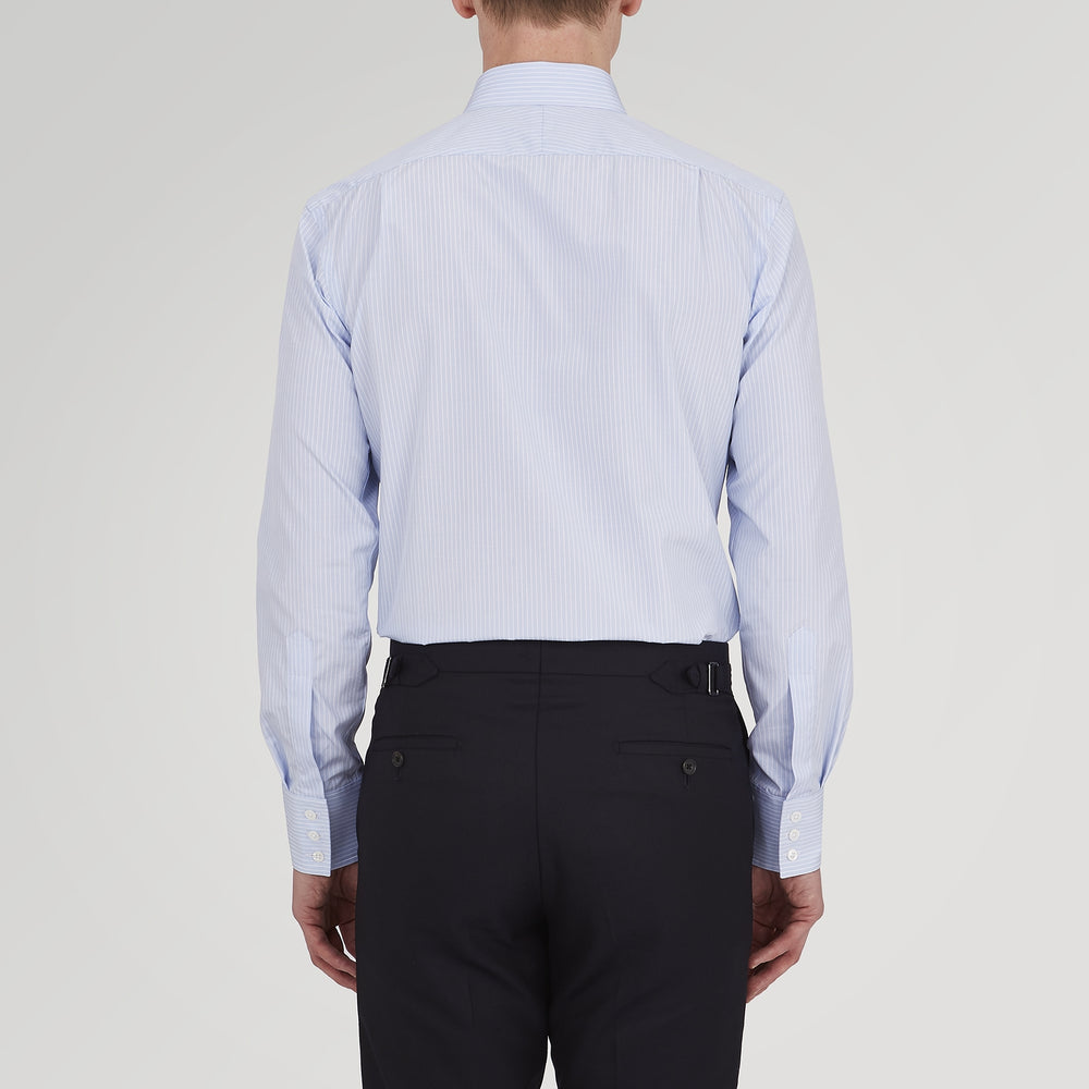 The Turnbull & Asser Tailored Fit Light Blue and White Pinstripe Shirt features a Bury collar and 3-button cuffs, neatly folded and displayed on a plain white background.
