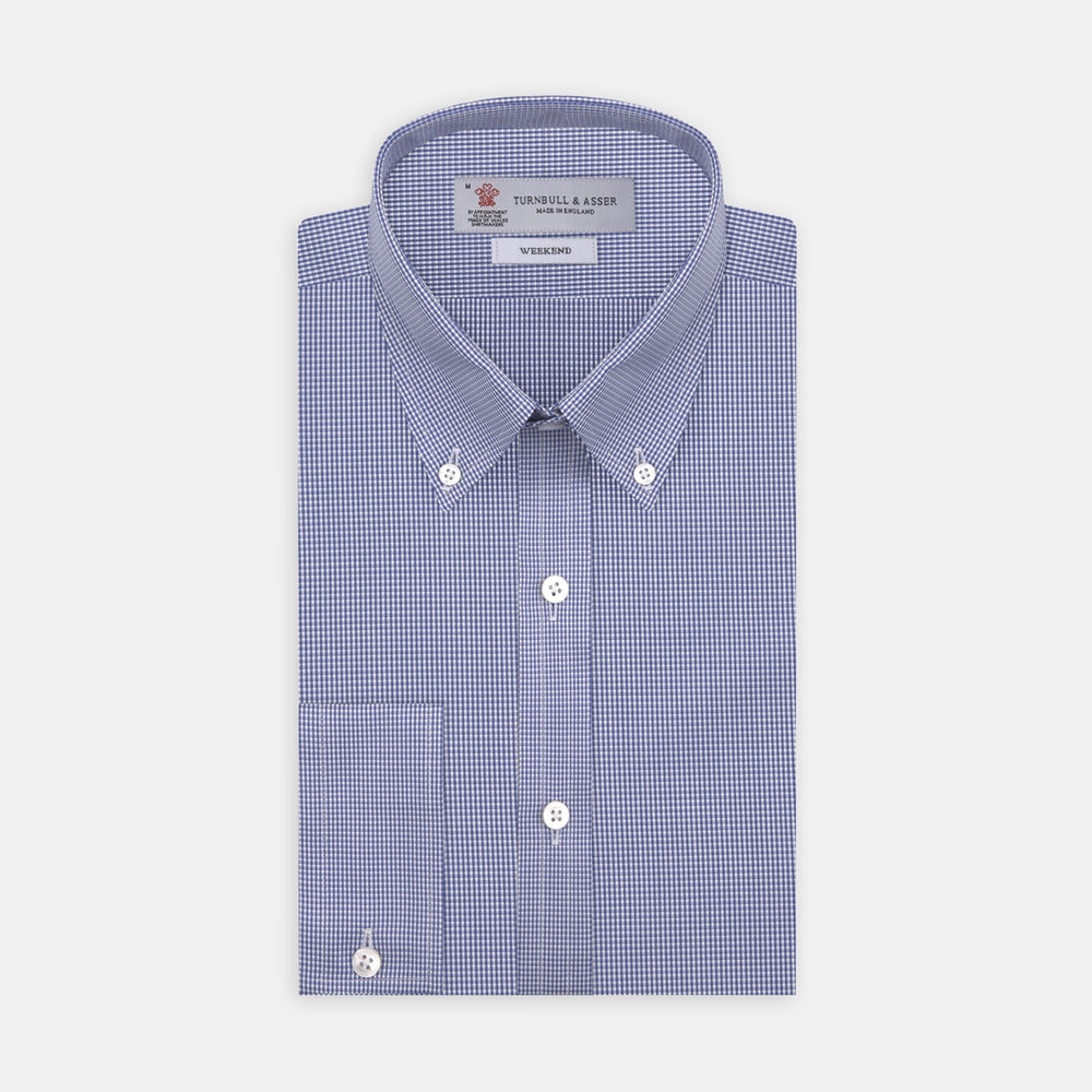 The Turnbull & Asser Weekend Fit Blue Puppytooth Shirt features a Dorset collar, 1-button cuffs, and a blue and white small check pattern. It is neatly folded with white buttons, displayed on a plain white background.
