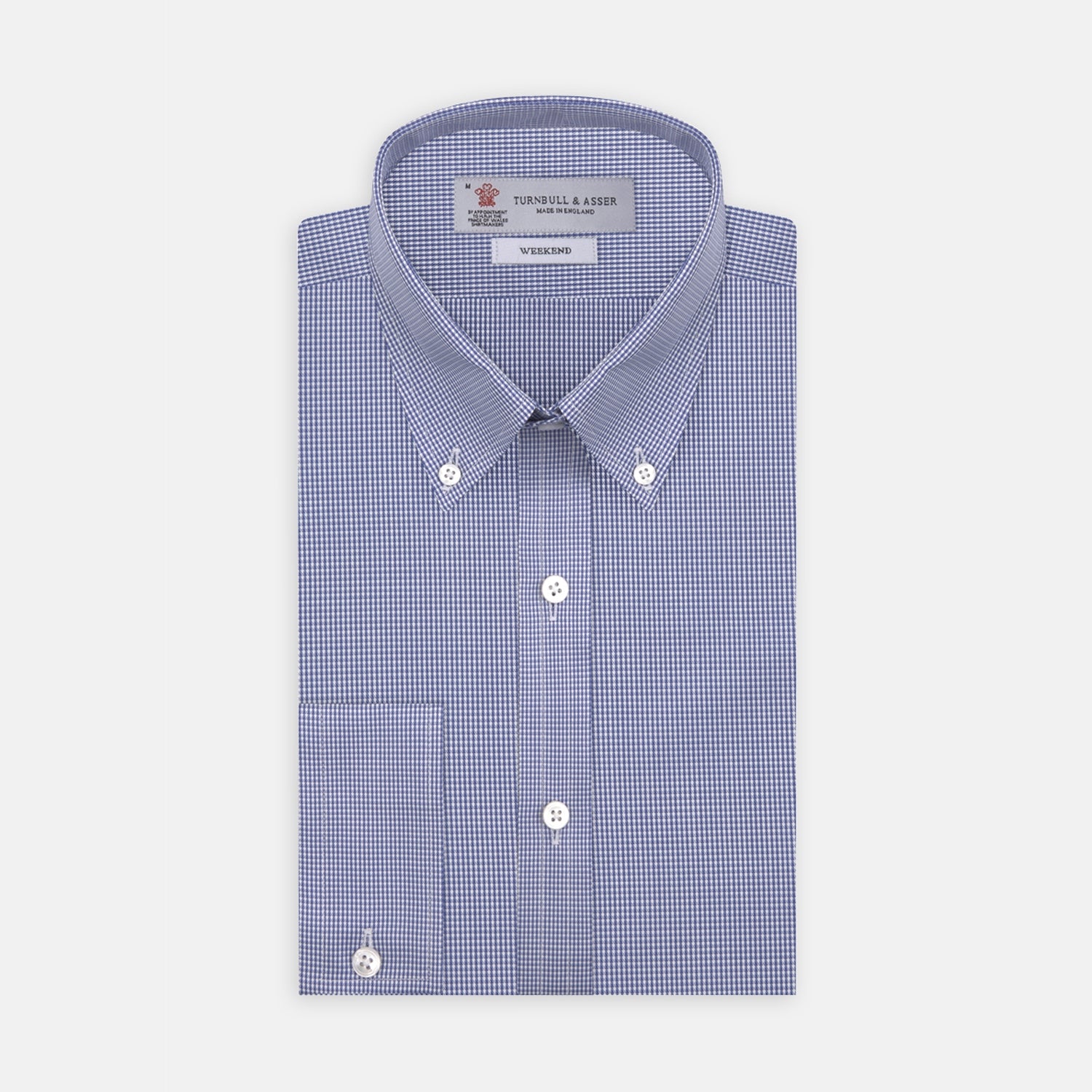 View 1 of product The Turnbull & Asser Weekend Fit Blue Puppytooth Shirt features a Dorset collar, 1-button cuffs, and a blue and white small check pattern. It is neatly folded with white buttons, displayed on a plain white background.