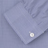 View 2 of product The Turnbull & Asser Weekend Fit Blue Puppytooth Shirt features a Dorset collar, 1-button cuffs, and a blue and white small check pattern. It is neatly folded with white buttons, displayed on a plain white background.