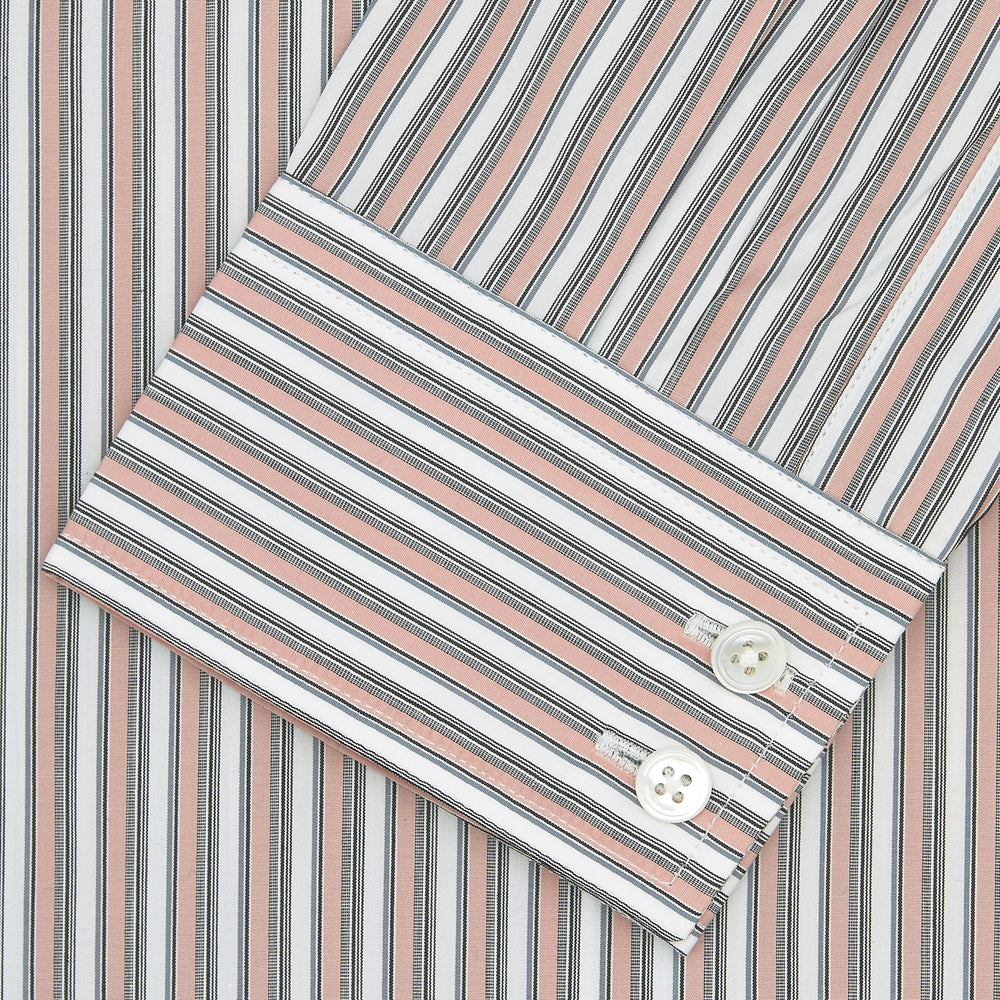 The Tailored Fit Pink and Grey Drawing Stripe Shirt by Turnbull & Asser features a Kent collar, 2-button cuffs, and vertical stripes in pink and grey for a refined look.