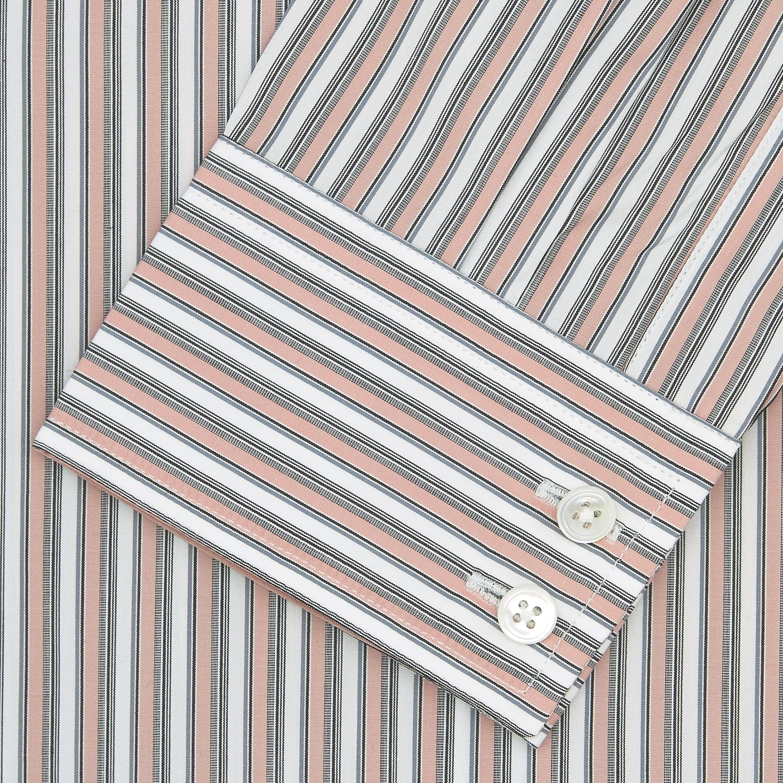 View 2 of product The Tailored Fit Pink and Grey Drawing Stripe Shirt by Turnbull & Asser features a Kent collar, 2-button cuffs, and vertical stripes in pink and grey for a refined look.