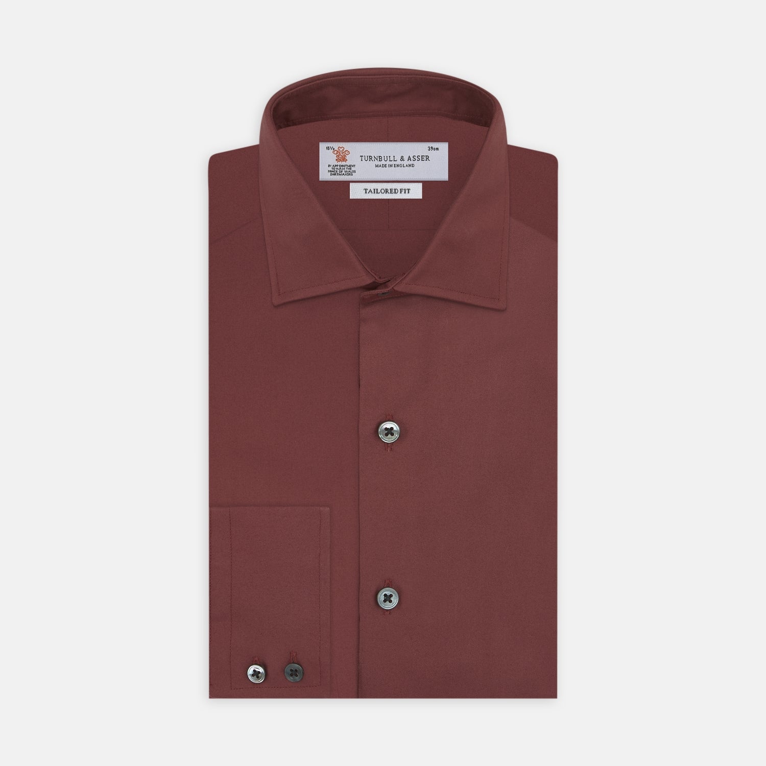 View 1 of product The Turnbull & Asser Tailored Fit Burgundy Cotton Shirt features a classic Kent collar and 2-button cuffs, displayed neatly folded with dark buttons against a plain white background.