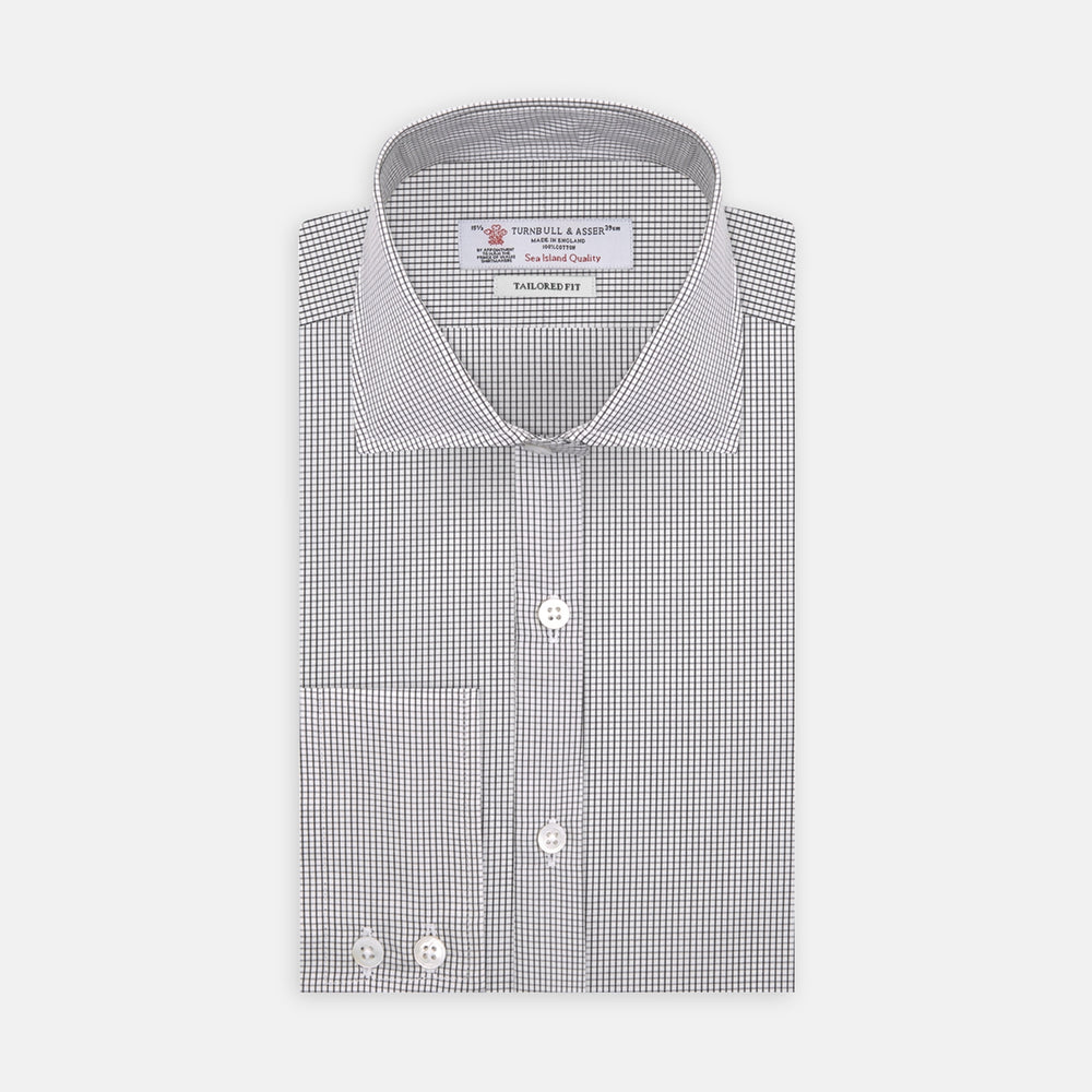 A neatly folded Turnbull & Asser Tailored Fit Grey and White Small Check Shirt with a Kent collar and 2-button cuffs is shown, featuring its brand label inside the collar.