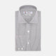 A neatly folded Turnbull & Asser Tailored Fit Grey and White Small Check Shirt with a Kent collar and 2-button cuffs is shown, featuring its brand label inside the collar.