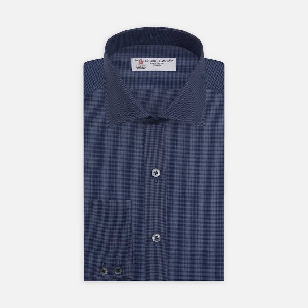 The Turnbull & Asser Tailored Fit Navy Check Flannel Shirt with Kent Collar and 2-button cuffs is neatly folded and displayed against a plain white background.