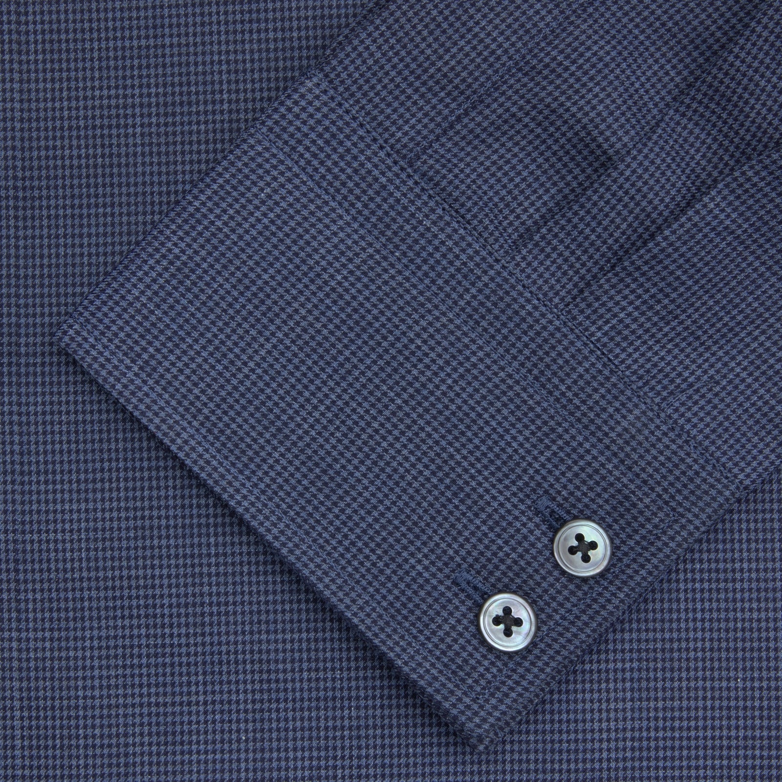 View 2 of product The Turnbull & Asser Tailored Fit Navy Check Flannel Shirt with Kent Collar and 2-button cuffs is neatly folded and displayed against a plain white background.
