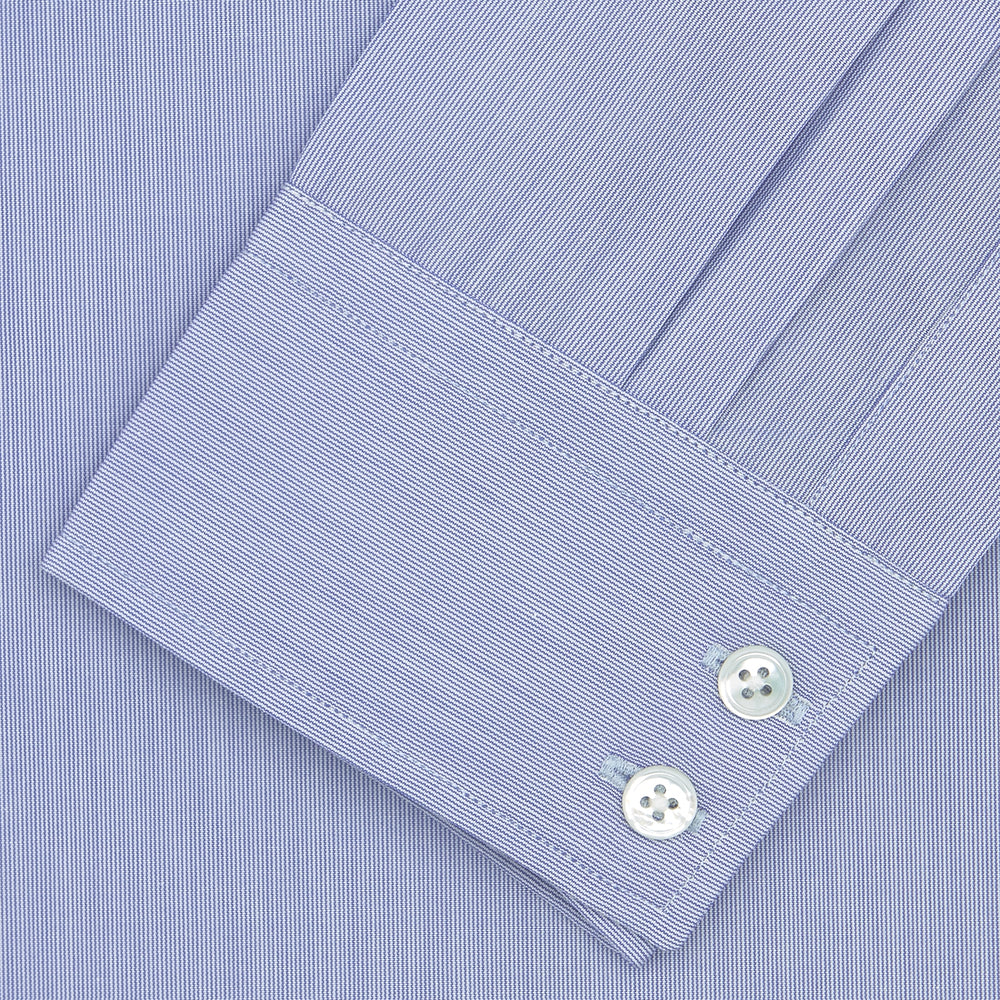 A neatly folded Turnbull & Asser Blue Hairline Stripe Tailored Fit Shirt with a Kent collar and double cuffs is displayed on a plain white background, with the brand label visible inside the collar.