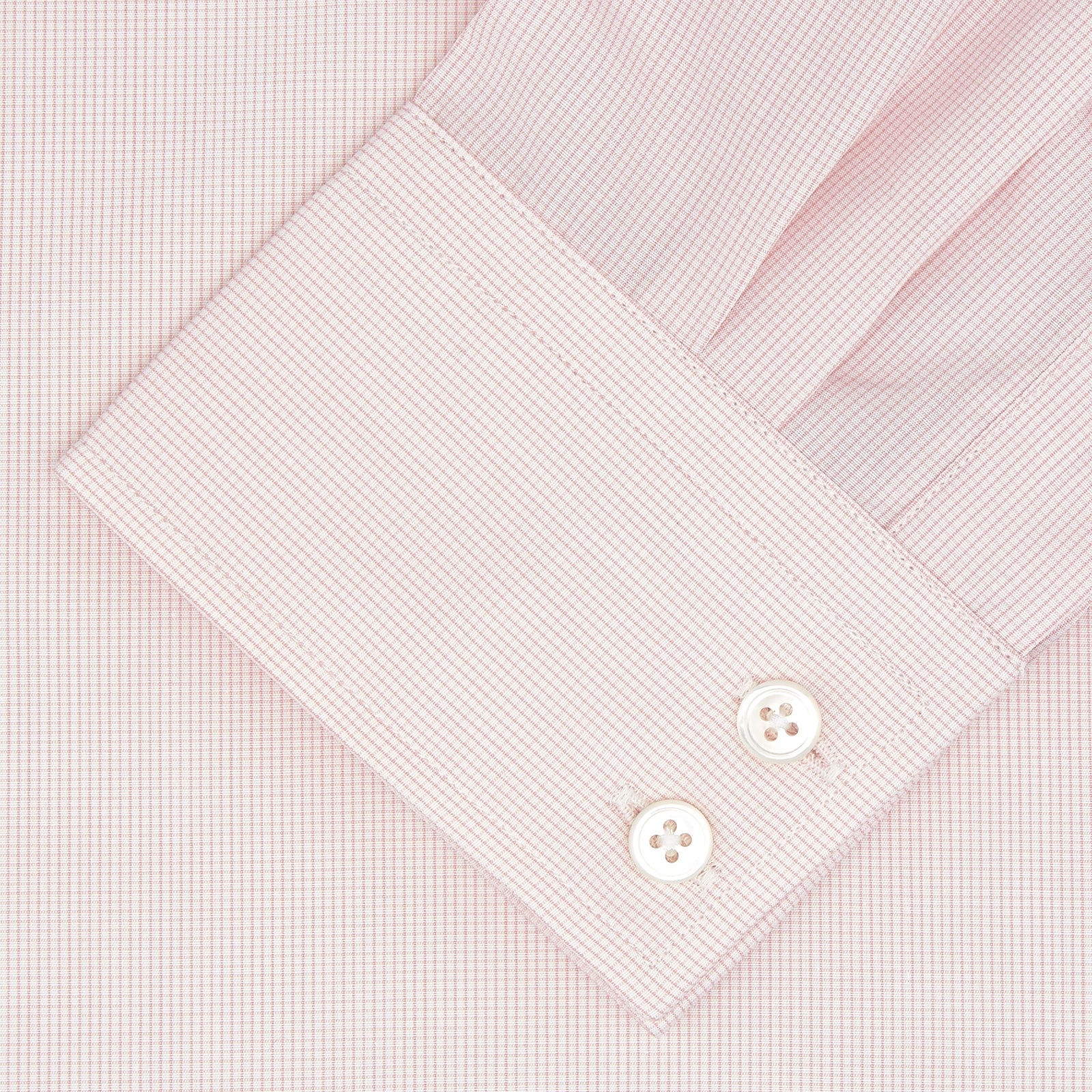 View 2 of product The Turnbull & Asser Tailored Fit Pink Fine Check Shirt features a Kent collar, 2-button cuffs, subtle check pattern, and white buttons, with a tailored fit label inside the collar.