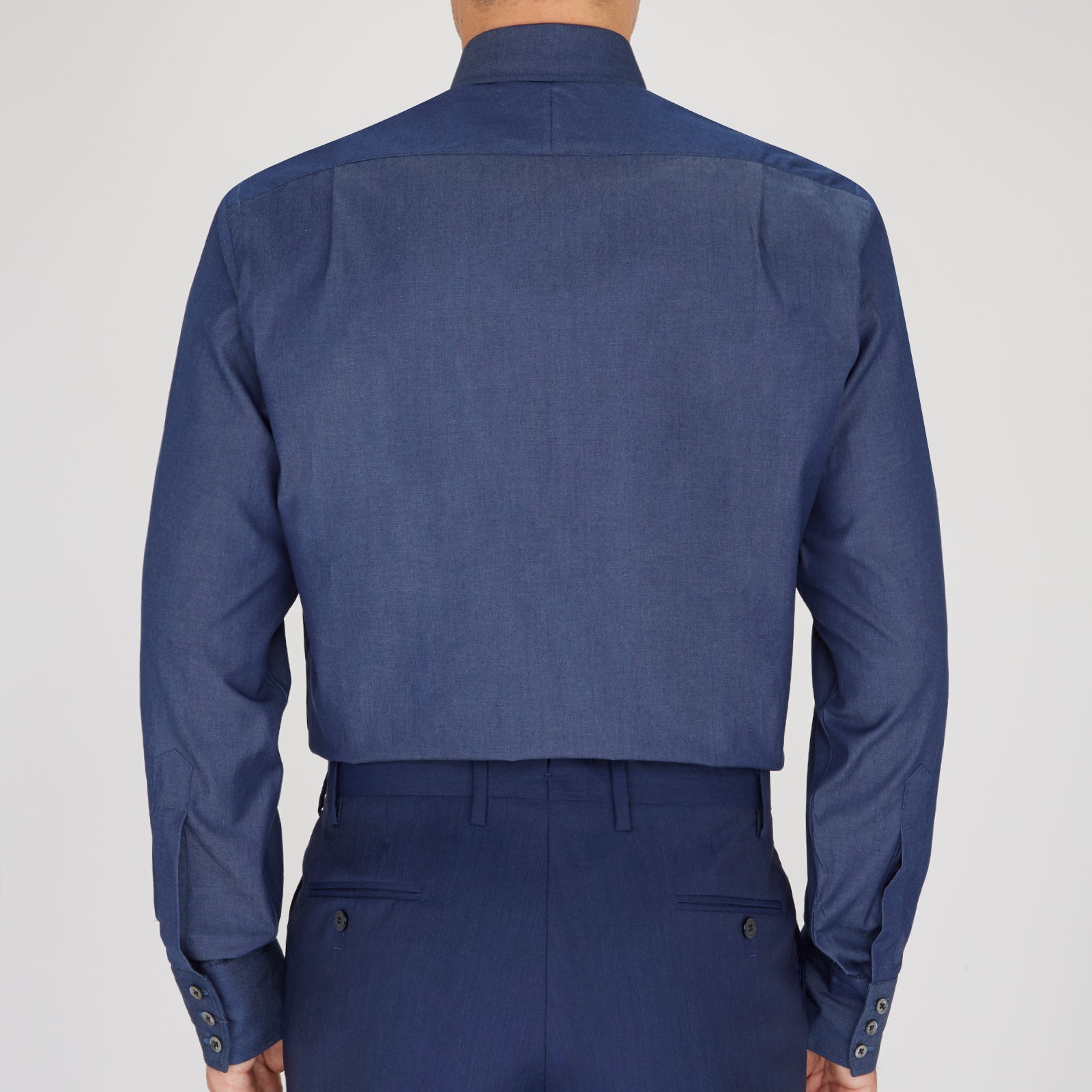 View 3 of product A neatly folded Turnbull & Asser Dark Blue Denim-Cashmere Dress Shirt with T&A collar and 3-button cuffs, showcased on a plain light background, offers a refined formal alternative.