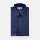 A neatly folded Turnbull & Asser Dark Blue Denim-Cashmere Dress Shirt with T&A collar and 3-button cuffs, showcased on a plain light background, offers a refined formal alternative.