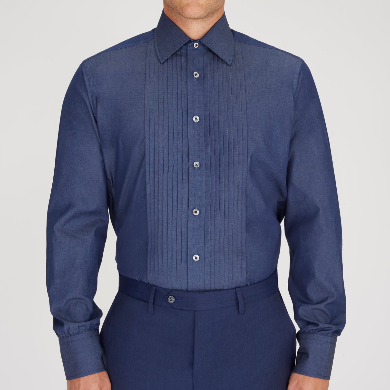 View 2 of product A neatly folded Turnbull & Asser Dark Blue Denim-Cashmere Dress Shirt with T&A collar and 3-button cuffs, showcased on a plain light background, offers a refined formal alternative.