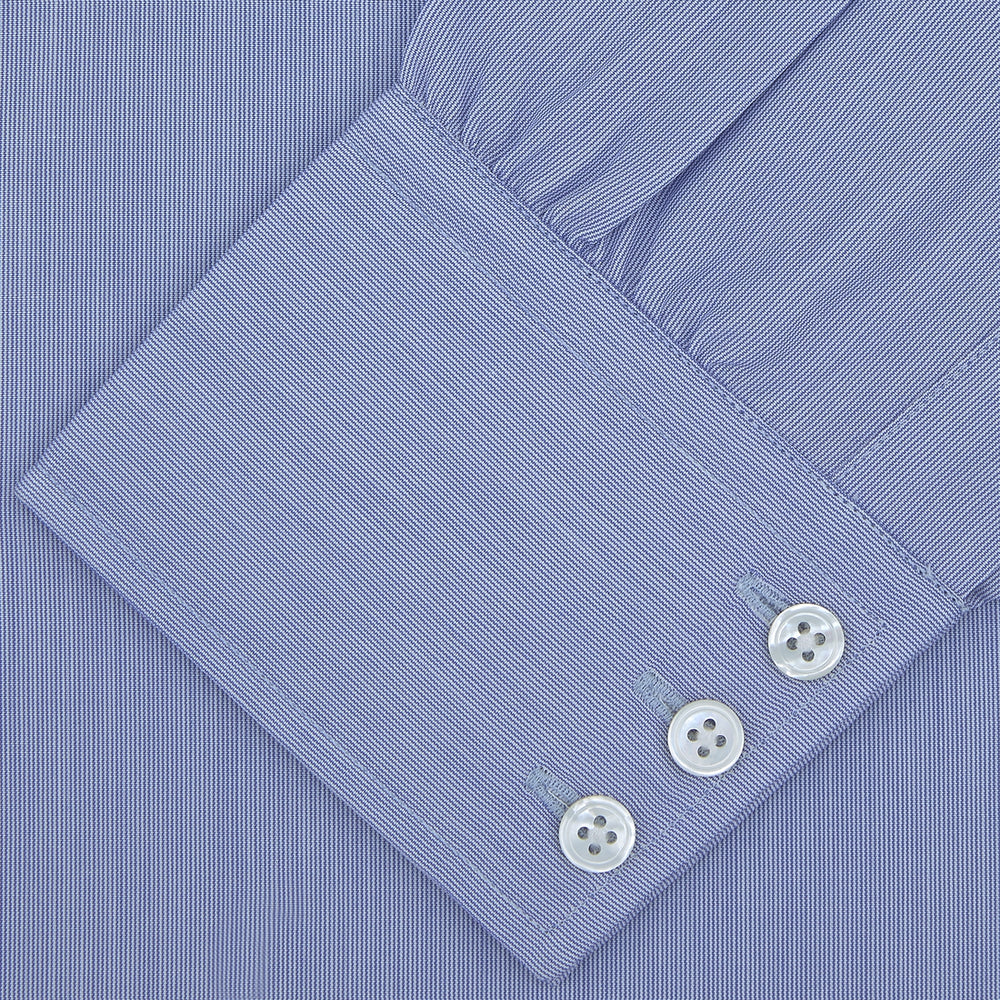 A Turnbull & Asser Blue Hairline Stripe Shirt with a Regent collar and 3-button cuffs is neatly folded, white label visible inside the collar, and displayed on a plain white background.