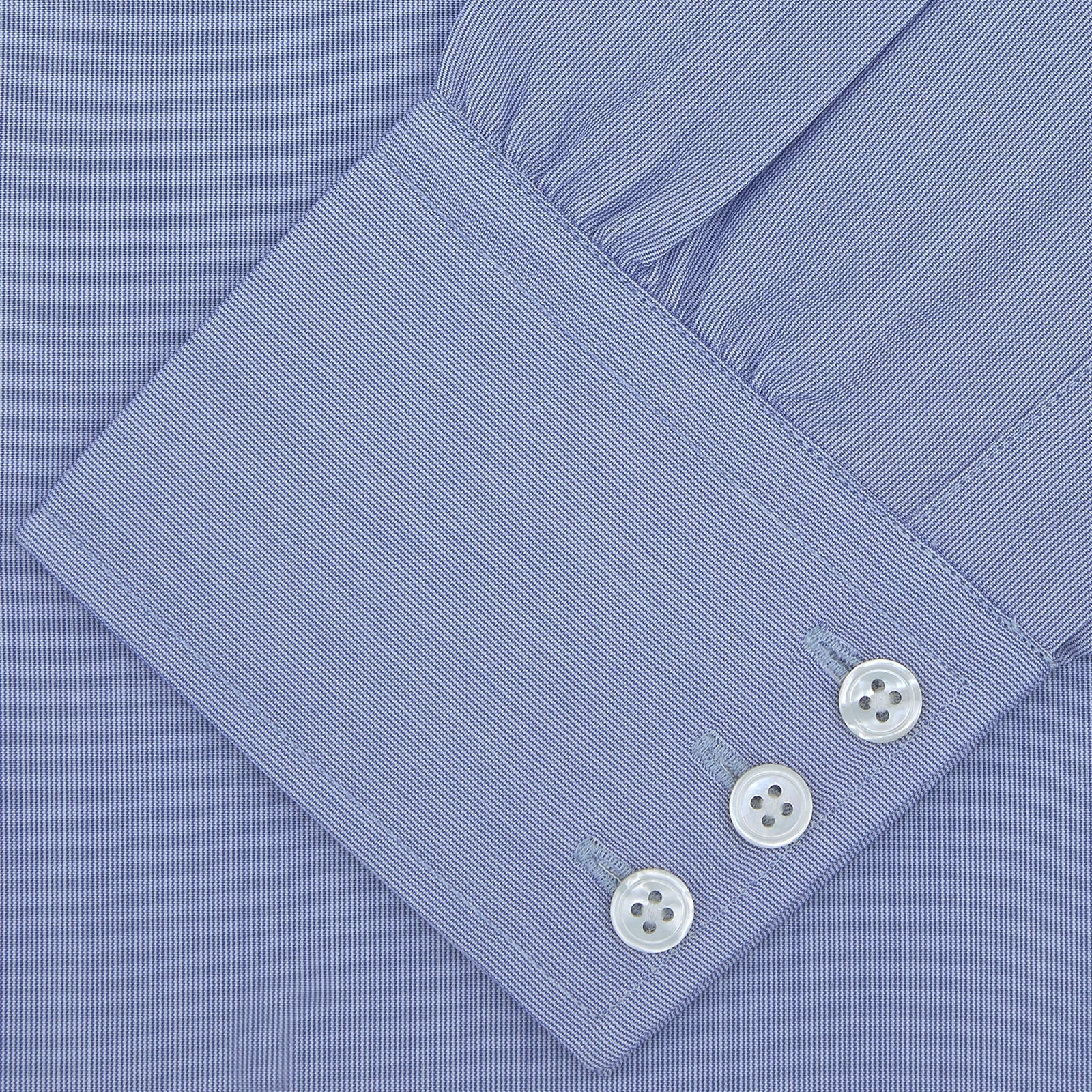 View 2 of product A Turnbull & Asser Blue Hairline Stripe Shirt with a Regent collar and 3-button cuffs is neatly folded, white label visible inside the collar, and displayed on a plain white background.