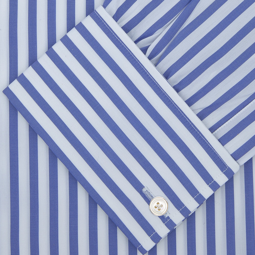 The Turnbull & Asser Blue and White Candy Stripe Shirt features a Regent collar, double cuffs, and white buttons, neatly folded against a plain white background.