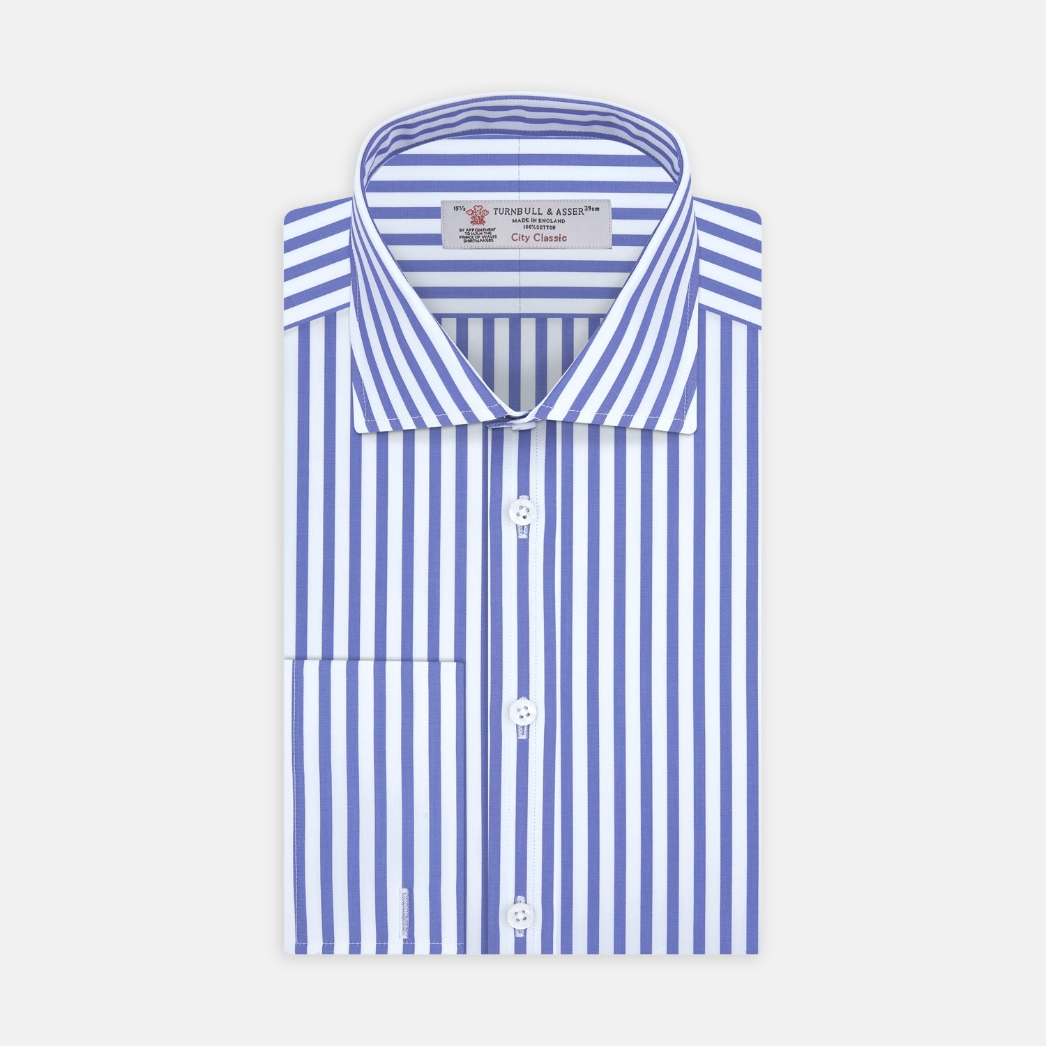 View 1 of product The Turnbull & Asser Blue and White Candy Stripe Shirt features a Regent collar, double cuffs, and white buttons, neatly folded against a plain white background.