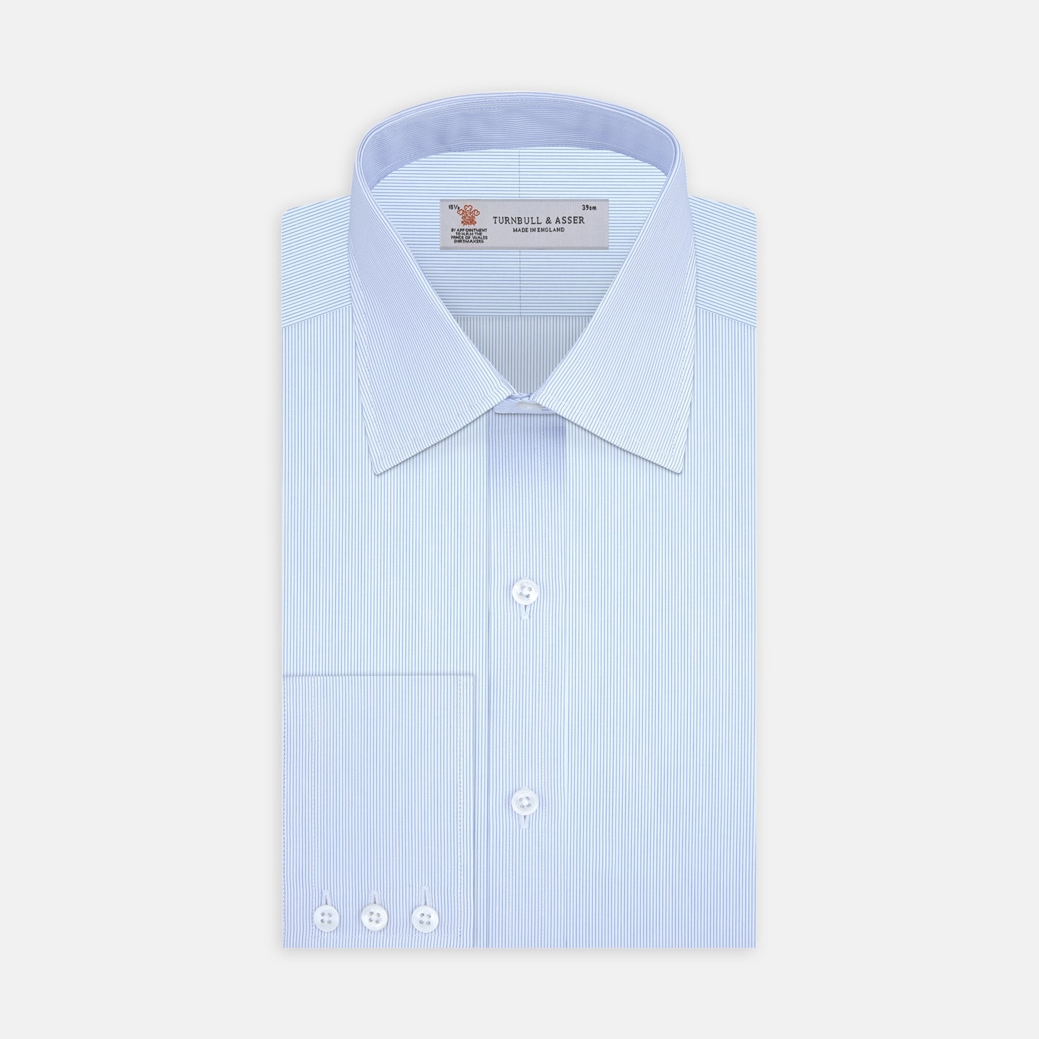 View 1 of product The Turnbull & Asser Blue Hairline Stripe Shirt features a T&A collar and 3-button cuffs, neatly folded with white buttons, shown on a plain white background—ideal as an office shirt.