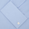View 2 of product The Turnbull & Asser Blue Hairline Stripe Shirt features a T&A collar, double cuffs, white buttons, and a crisp design—ideal for the office. Displayed neatly folded on a plain white background.