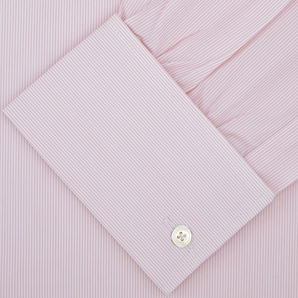 The Turnbull & Asser Pink Hairline Stripe Cotton Shirt features a T&A collar, double cuffs, neat vertical stripes, white buttons, and a chest pocket—perfect for the office. Shown neatly folded on a plain white background.