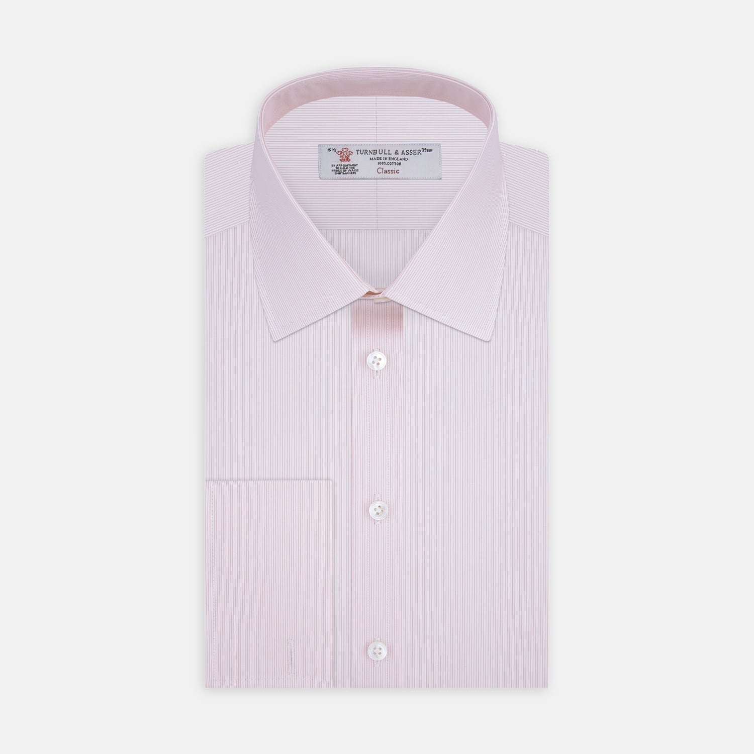 View 1 of product The Turnbull & Asser Pink Hairline Stripe Cotton Shirt features a T&A collar, double cuffs, neat vertical stripes, white buttons, and a chest pocket—perfect for the office. Shown neatly folded on a plain white background.