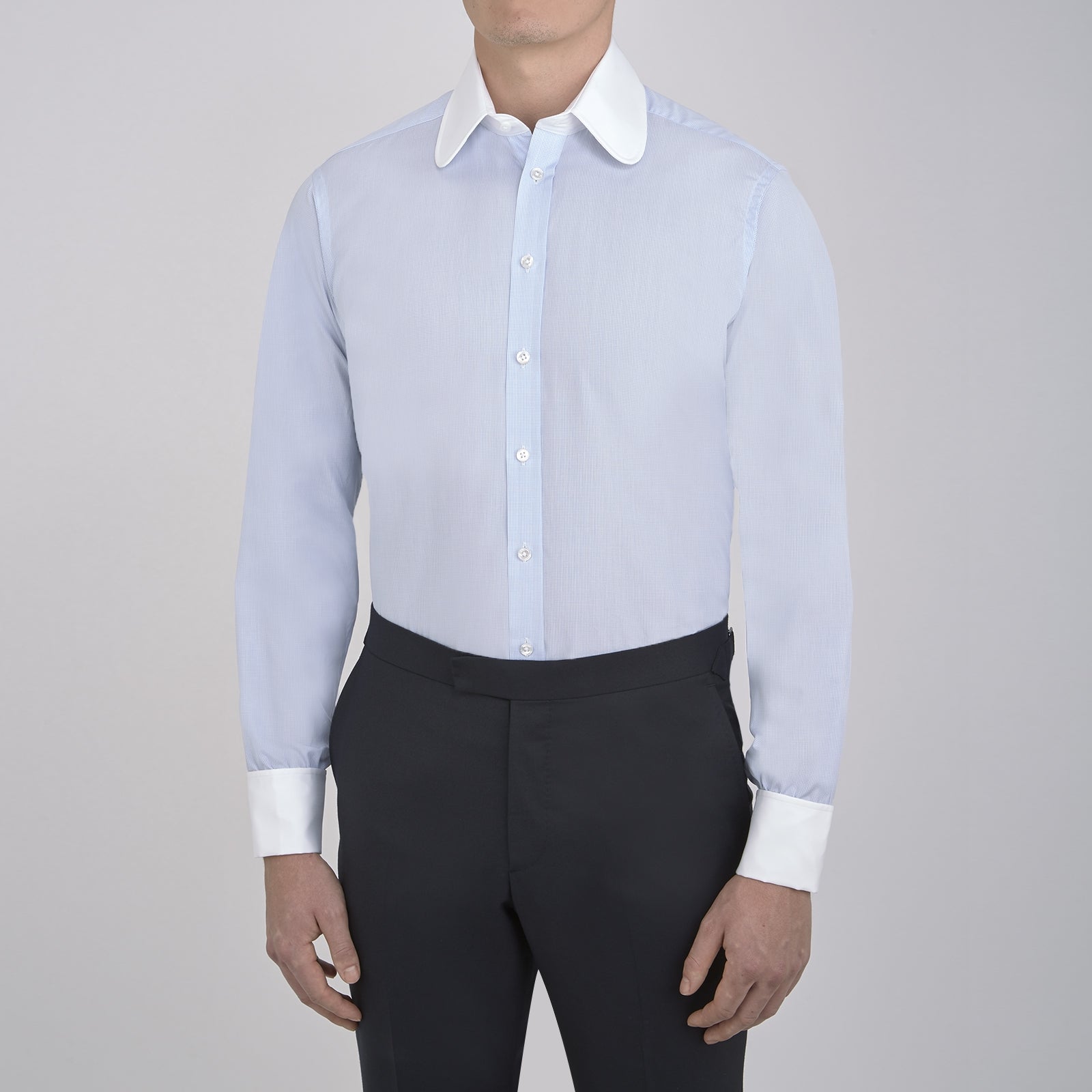 View 2 of product A neatly folded The Great Gatsby Cotton Shirt by Turnbull & Asser, featuring a light blue body, white rounded collar, and double cuffs inspired by 1920s style, displayed on a plain light background.