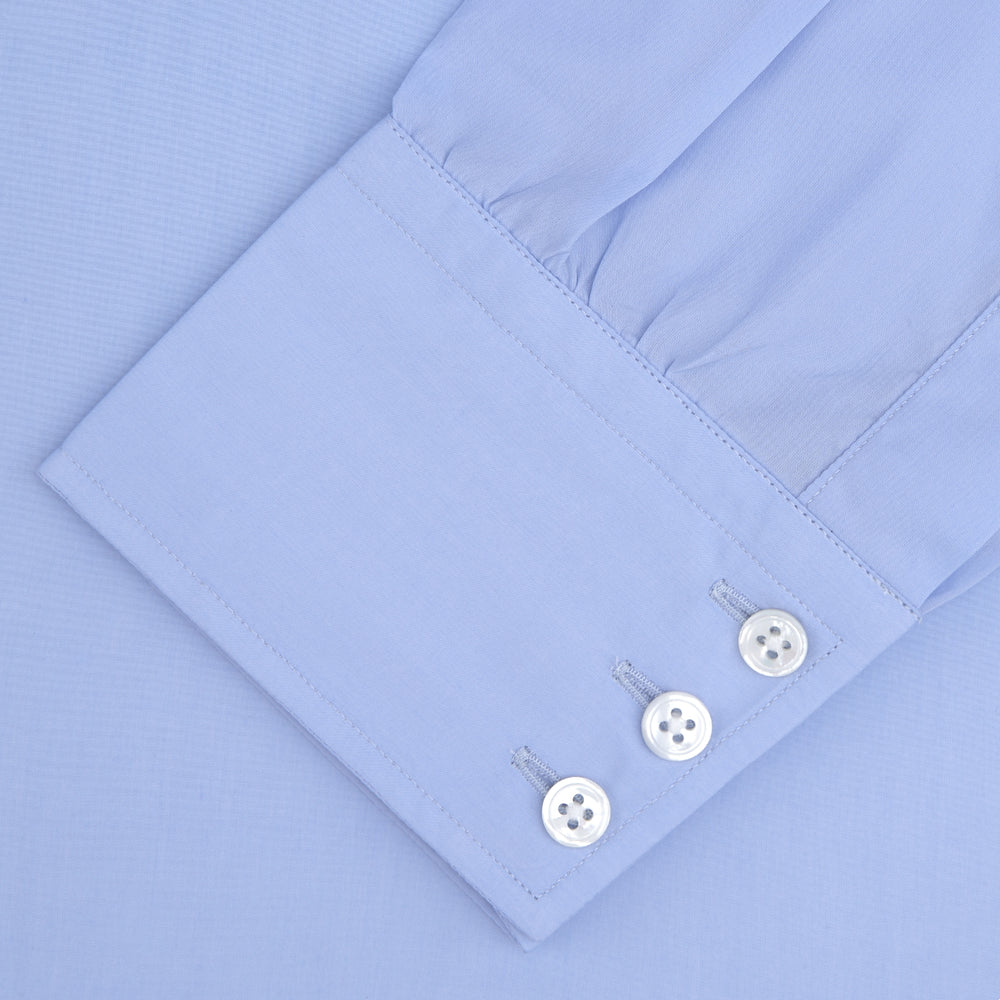 The Turnbull & Asser Two-Fold 200 Blue Cotton Shirt features a T&A collar, 3-button cuffs, and white buttons—a refined men's dress shirt displayed on a plain white background.