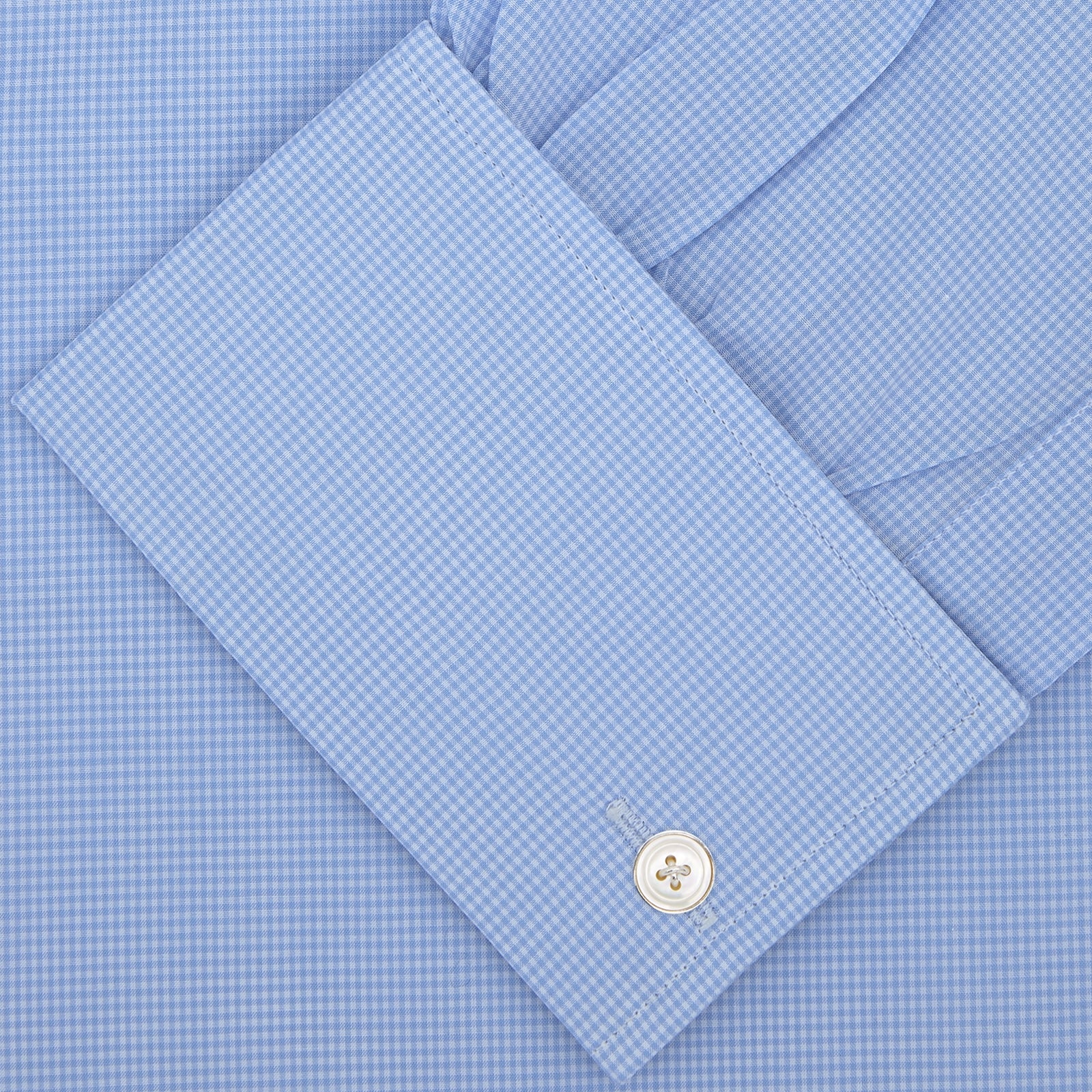 View 2 of product A Turnbull & Asser Sky Blue Micro-Check Shirt with T&A collar, double cuffs, and white buttons is neatly folded and displayed against a plain white background.