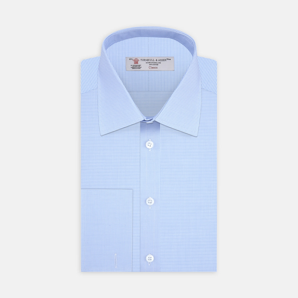 A Turnbull & Asser Sky Blue Micro-Check Shirt with T&A collar, double cuffs, and white buttons is neatly folded and displayed against a plain white background.
