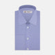 A neatly folded dark blue Sea Island quality cotton shirt by Turnbull & Asser, featuring a T&A collar, double cuffs, and white buttons, is displayed against a plain white background.