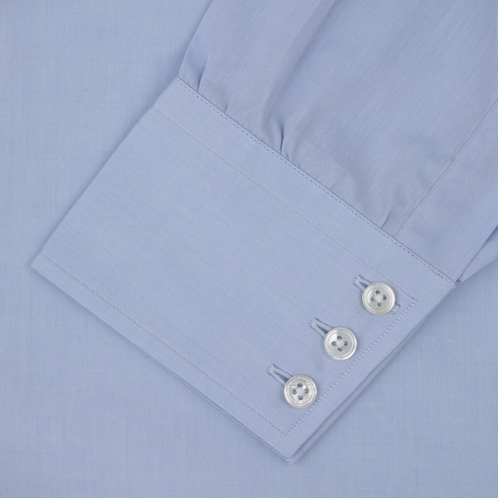 The Turnbull & Asser Blue West Indian Sea Island Cotton Shirt features a T&A collar, 3-button cuffs, white buttons, a front chest pocket, and a monogrammed label inside the collar.