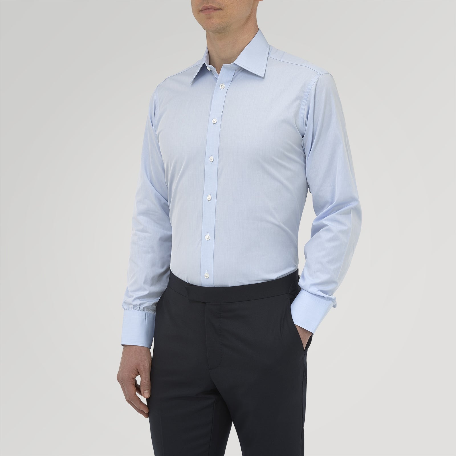 View 2 of product The Turnbull & Asser Blue West Indian Sea Island Cotton Shirt features a T&A collar, 3-button cuffs, white buttons, a front chest pocket, and a monogrammed label inside the collar.