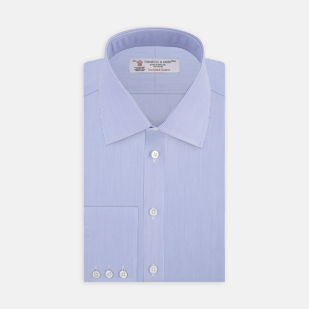 A circular swatch of Turnbull & Asser’s Blue Fine Bengal Stripe Sea Island Quality Cotton Fabric, featuring light blue and white vertical pinstripes and a gray border, is shown on a plain white background.