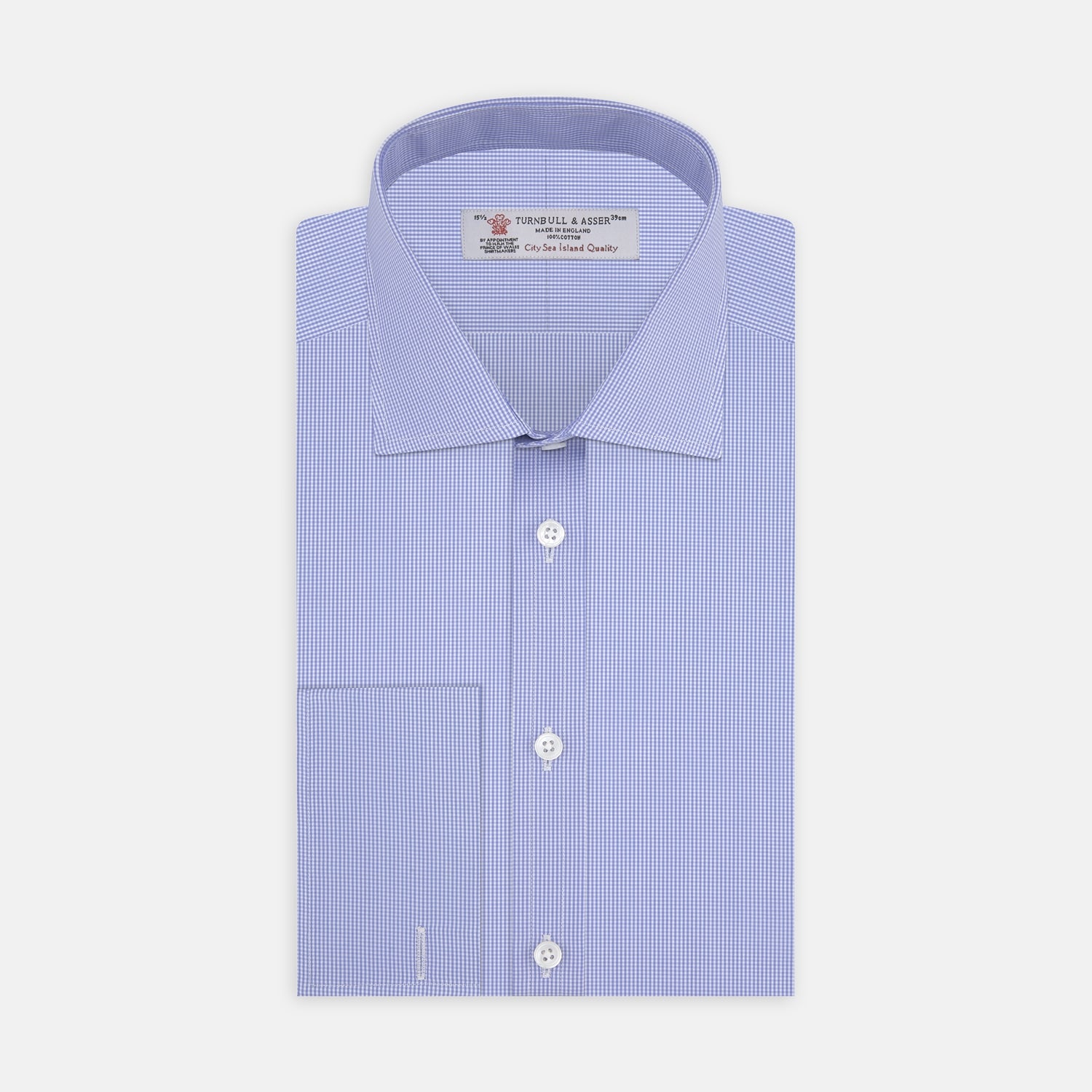 View 1 of product The Turnbull & Asser Blue Fine Check Sea Island Quality Cotton Shirt features a Regent collar, double cuffs, a subtle checkered pattern, and white buttons, displayed neatly folded on a white background.