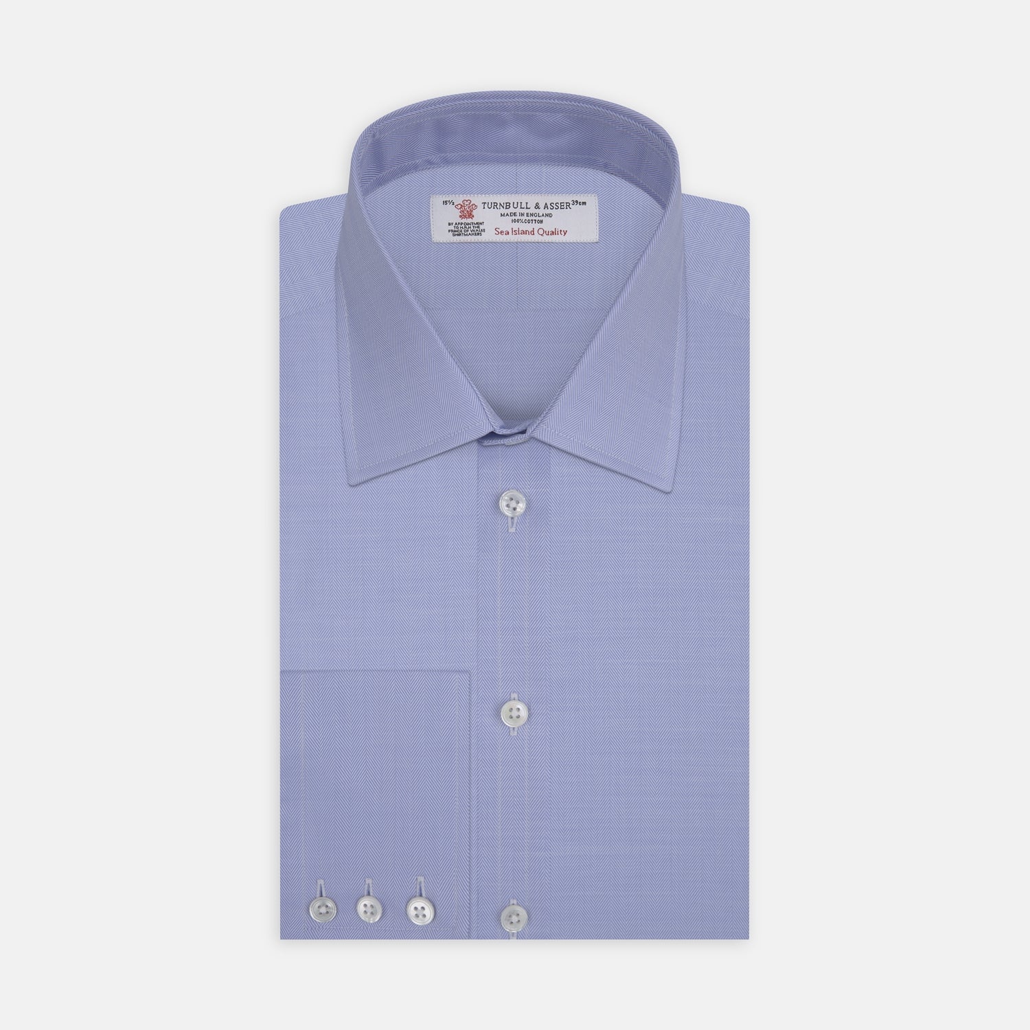 View 1 of product The Blue Herringbone Sea Island Quality Cotton Shirt by Turnbull & Asser features a T&A collar, 3-button cuffs, and is crafted from luxurious cotton. The shirt is displayed neatly folded on a plain white background.