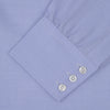 View 4 of product The Blue Herringbone Sea Island Quality Cotton Shirt by Turnbull & Asser features a T&A collar, 3-button cuffs, and is crafted from luxurious cotton. The shirt is displayed neatly folded on a plain white background.